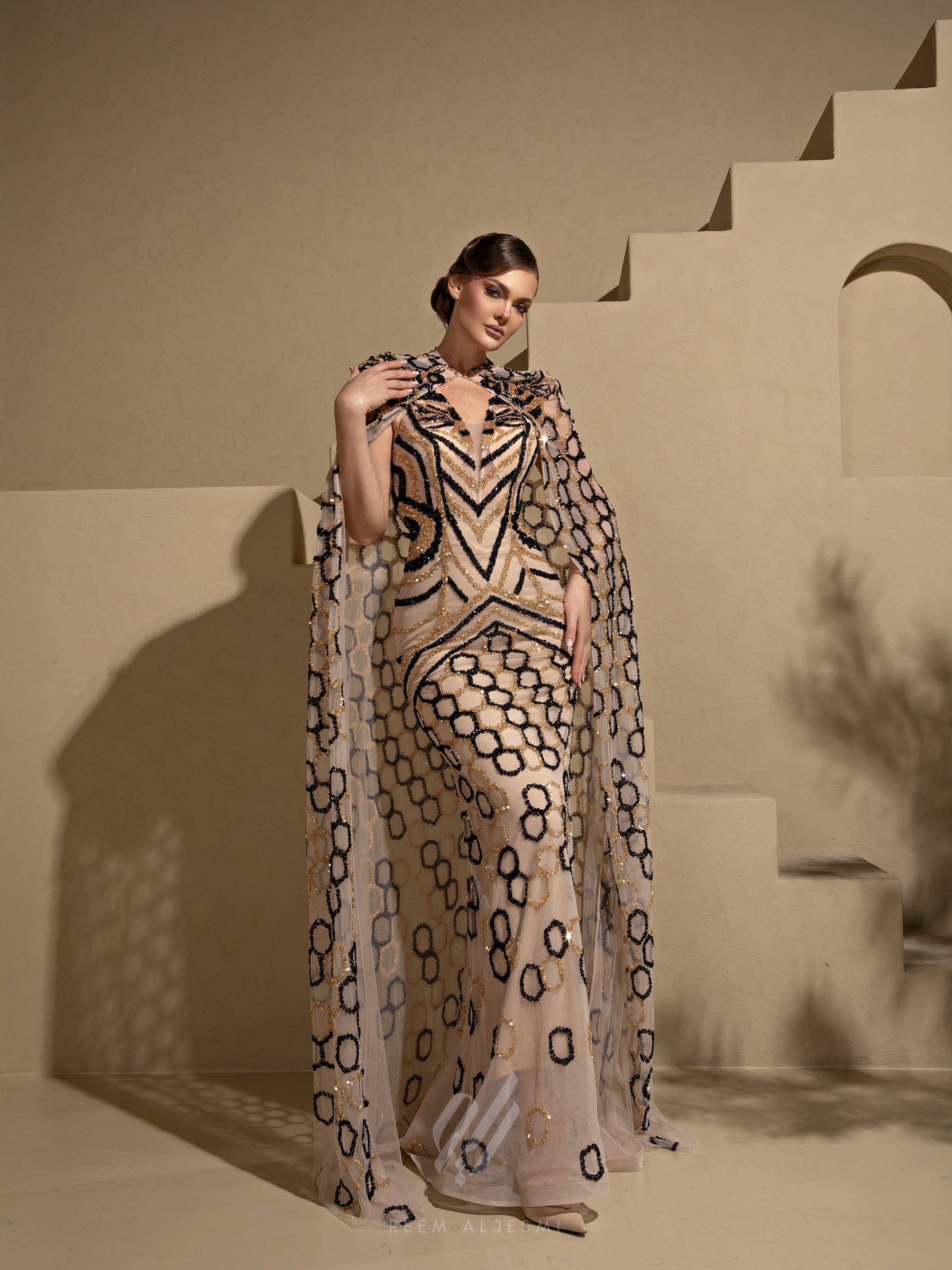 Ring Motif Cape Gown